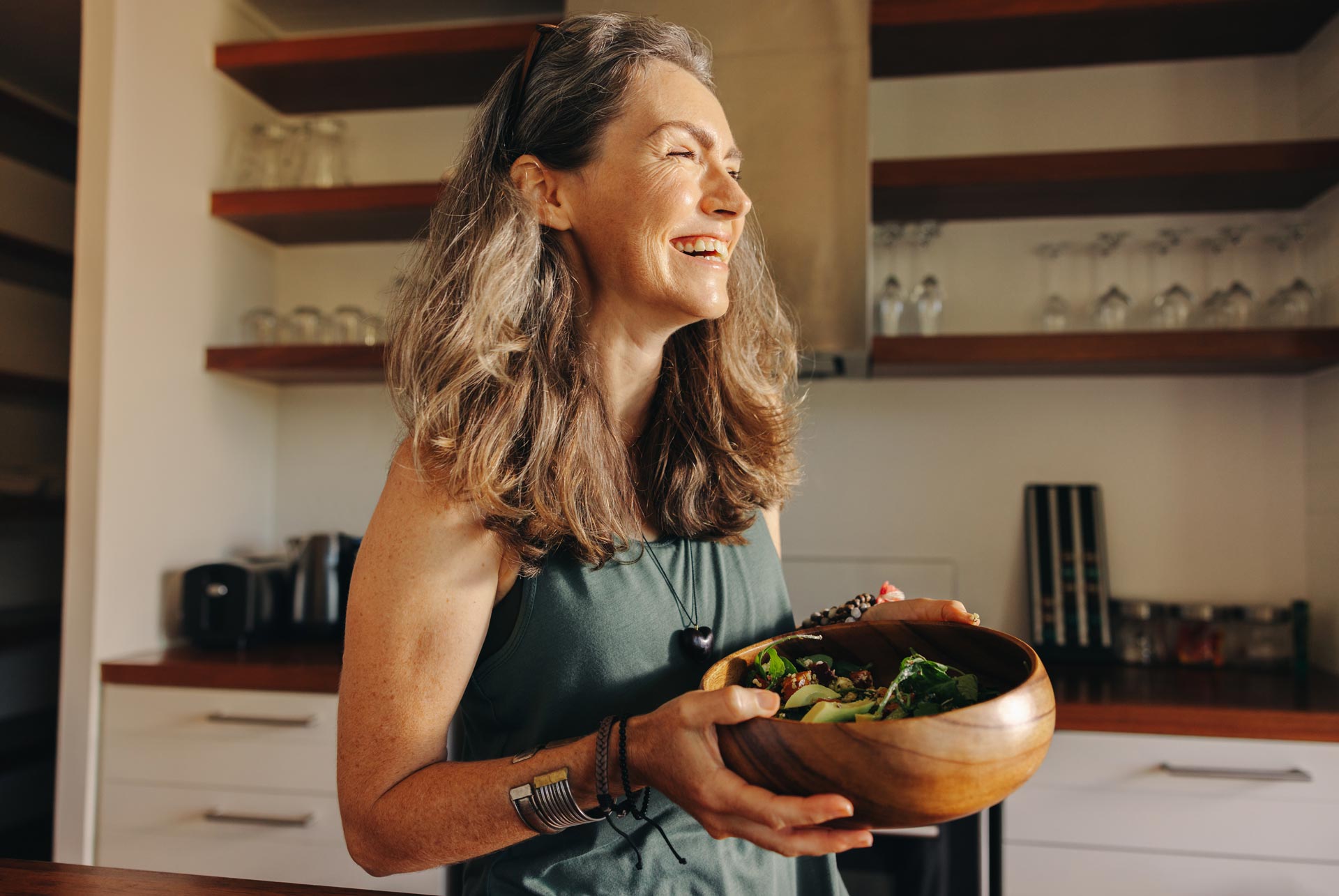 Smiling lady hold bowl happy with ostomy